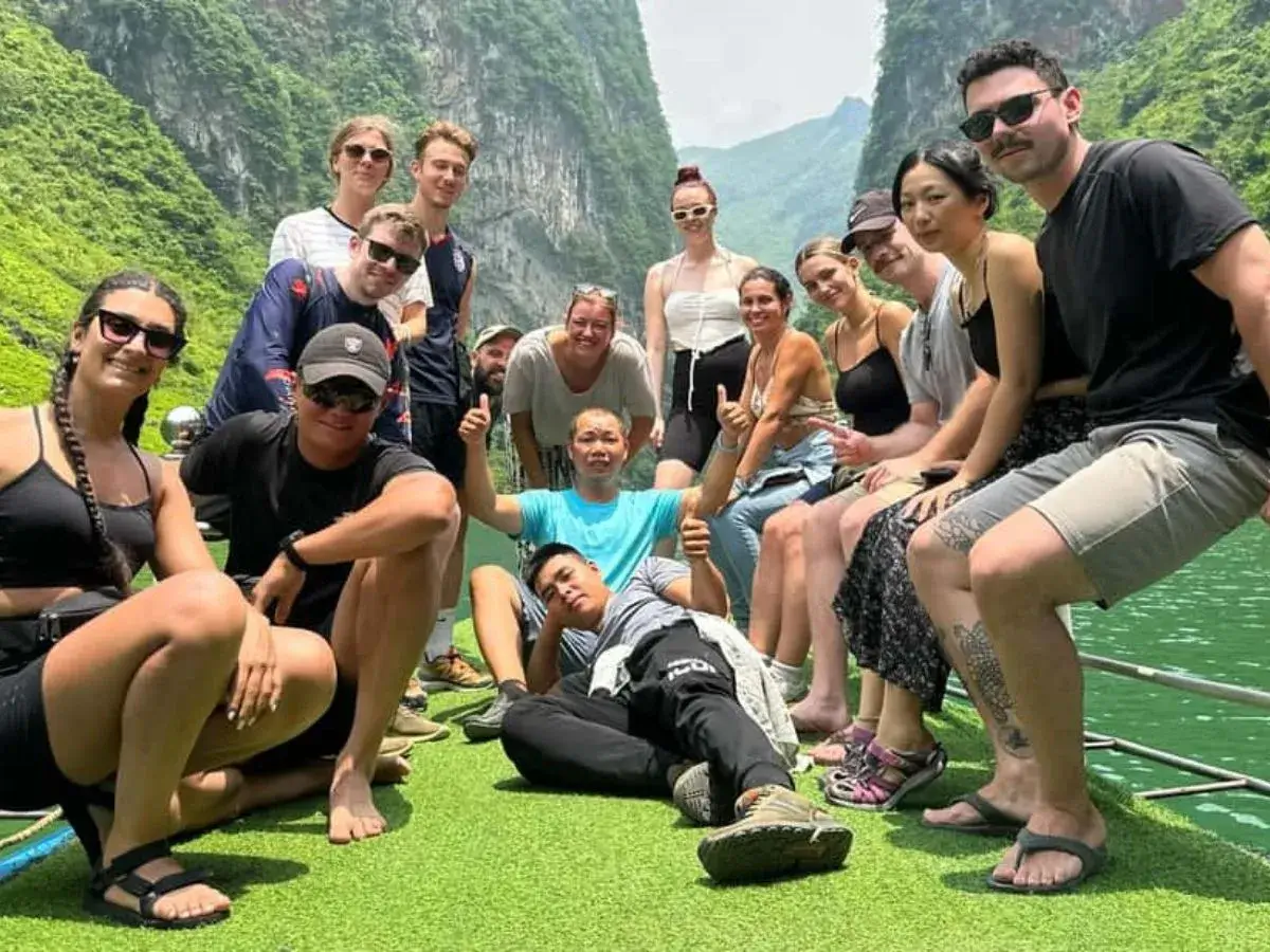 Sit on a boat to admire the Nho Que River in Ha Giang