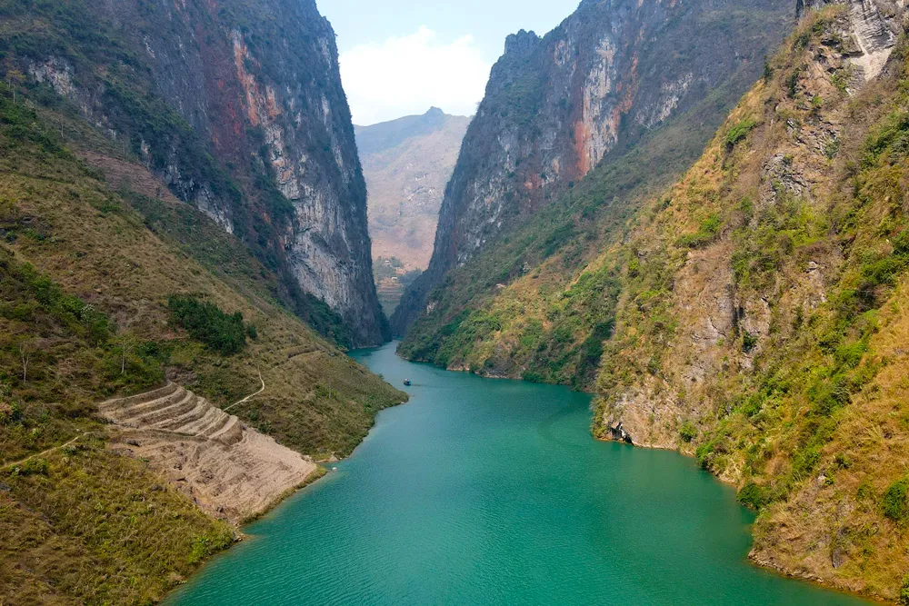 The Nho Que River is special for its stunning emerald green waters, dramatic canyon views