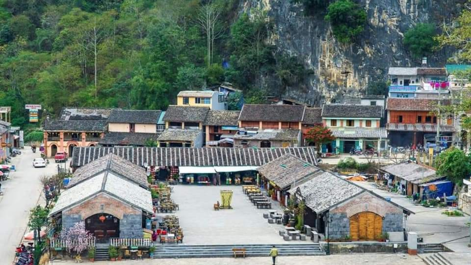 Ancient houses with yin-yang tiled roofs covered in moss – a unique architectural signature of Dong Van Ancient Town.