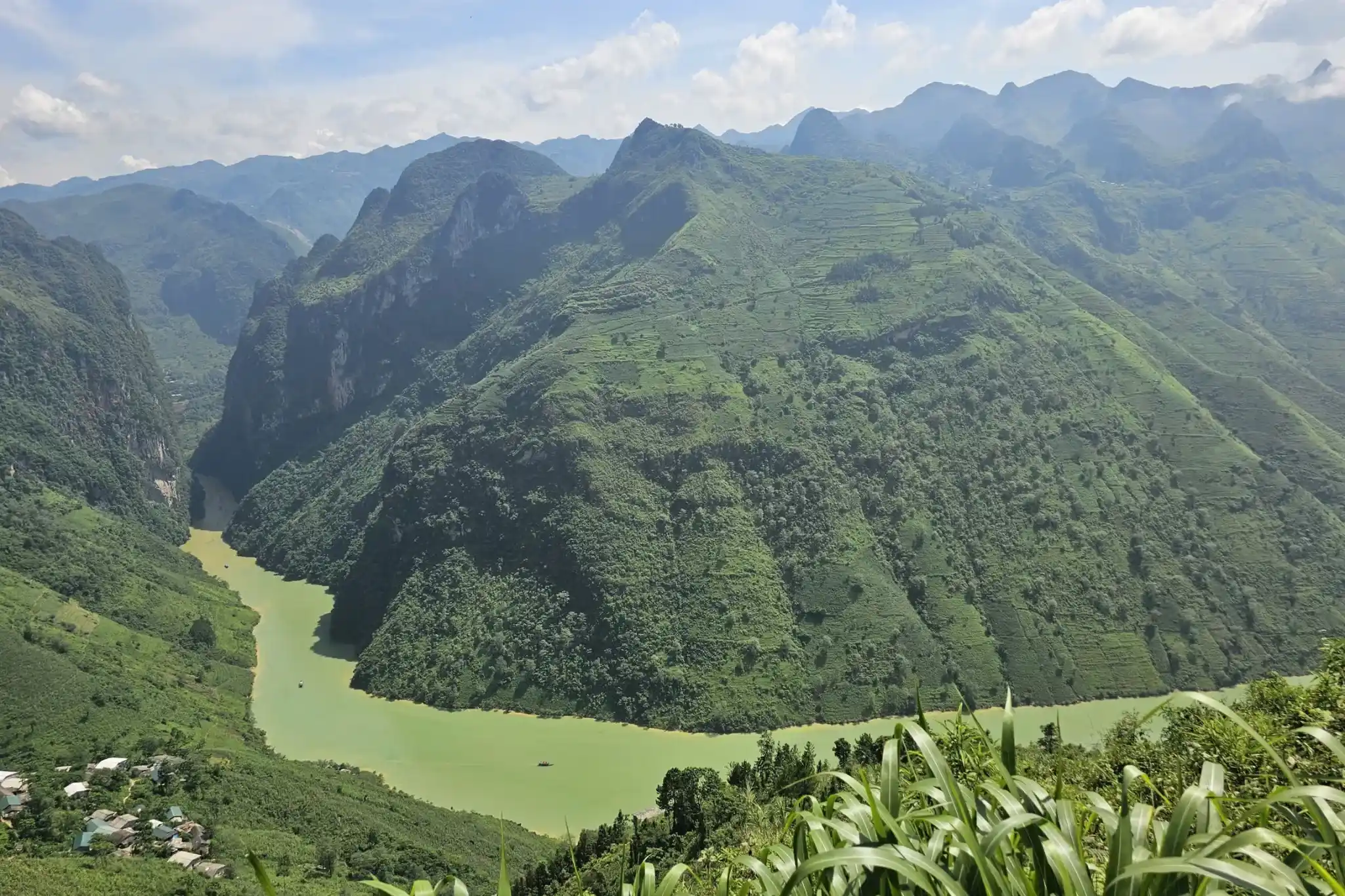 Nho Que River viewed from Ma Pi Leng Pass, a must-see for anyone comparing Ha Giang Loop or Sapa for their next adventure